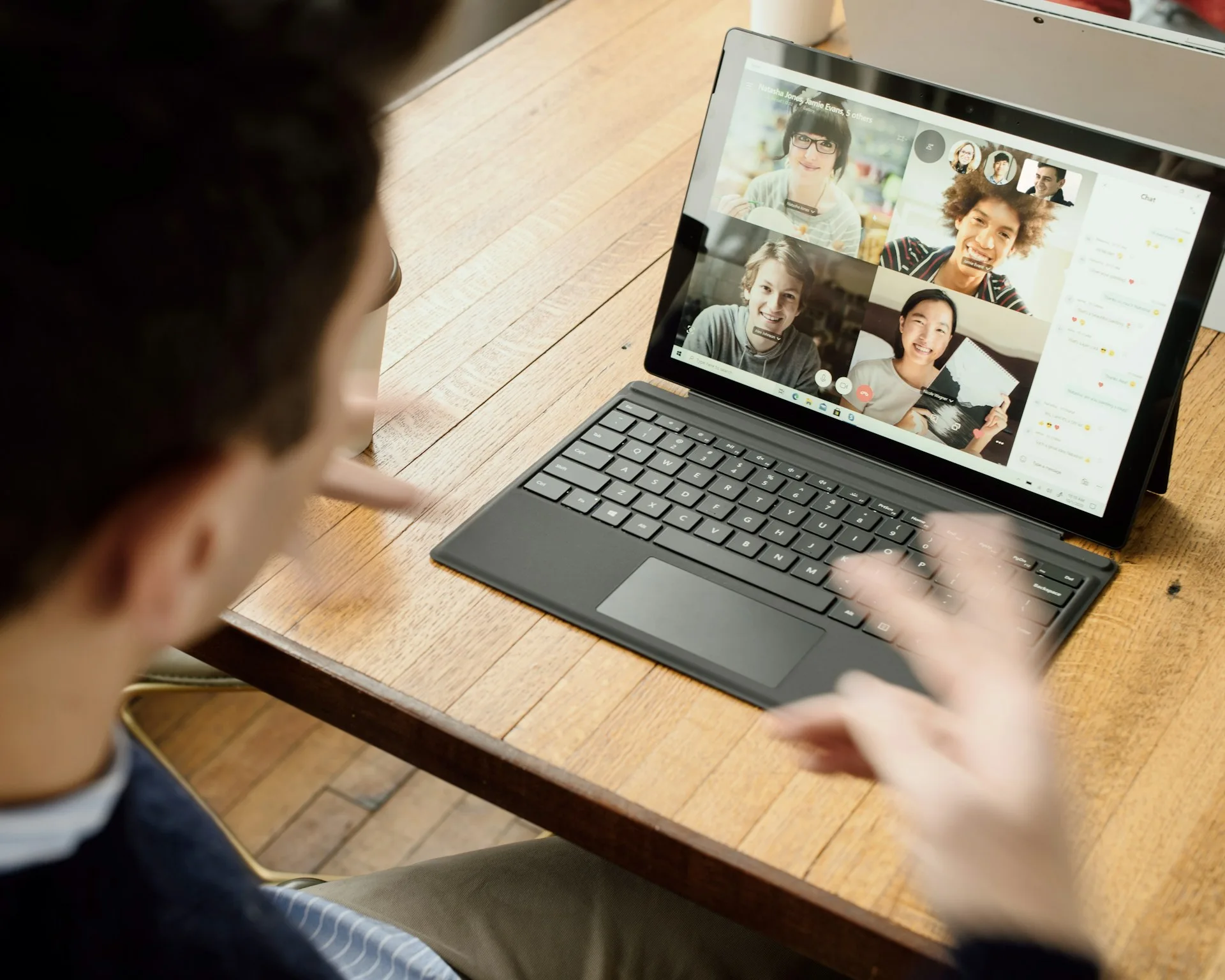Someone having an online meeting on a laptop