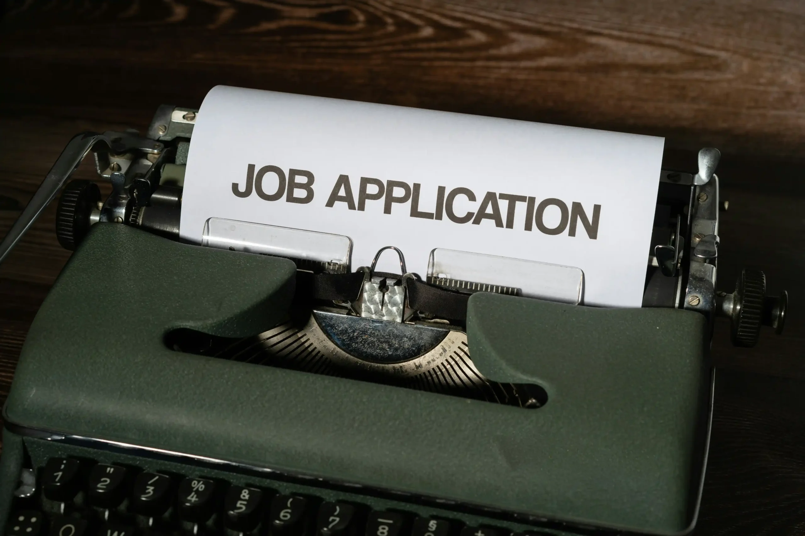 Typewriter with a sheet that says Job application